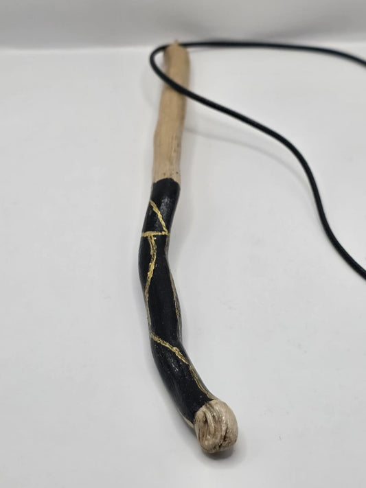 Long driftwood pendant necklace featuring black and gold kintsugi style design