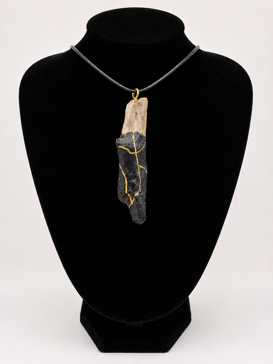 Driftwood pendant necklace featuring black and gold kintsugi style design