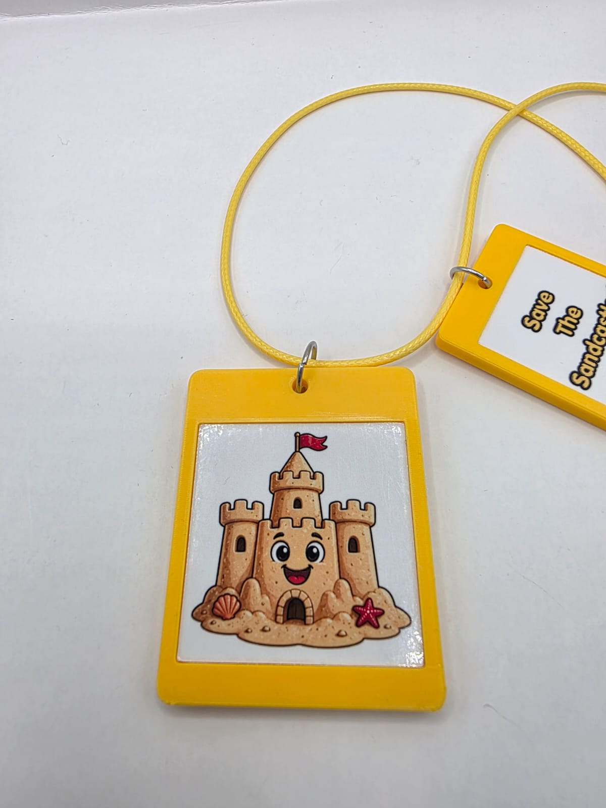 Fun Sandcastle Seaside Theme Lightweight Picture Necklace with Double Pendant. Save the Sandcastles