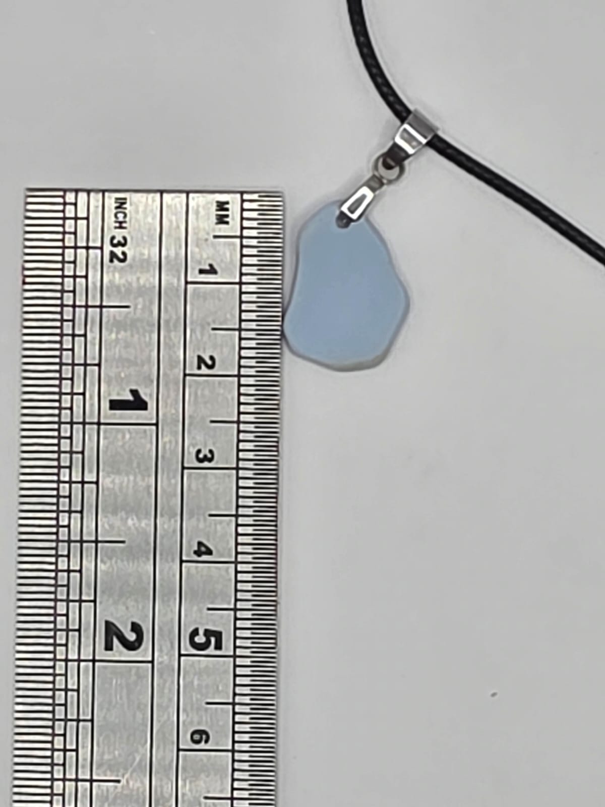 Light blue Sea pottery pendant necklace on a black waxed cord adjustable necklace