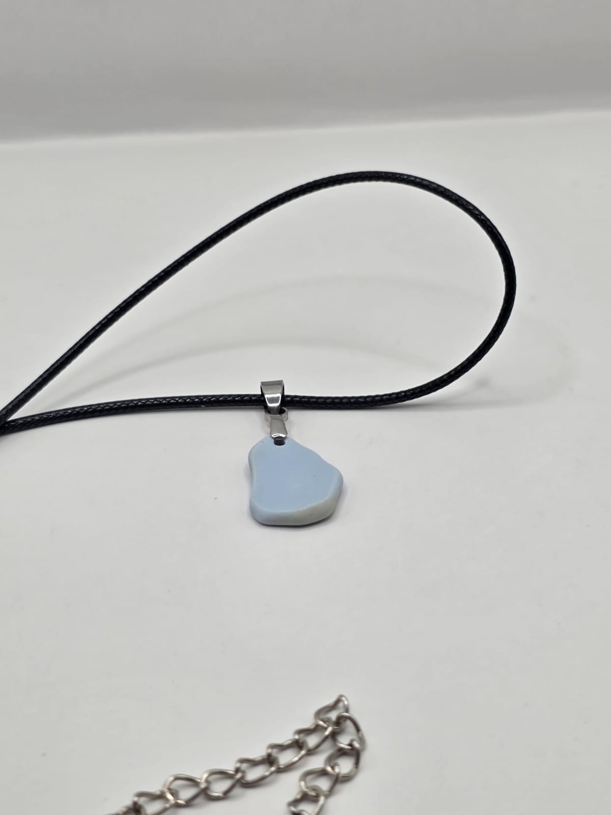 Light blue Sea pottery pendant necklace on a black waxed cord adjustable necklace