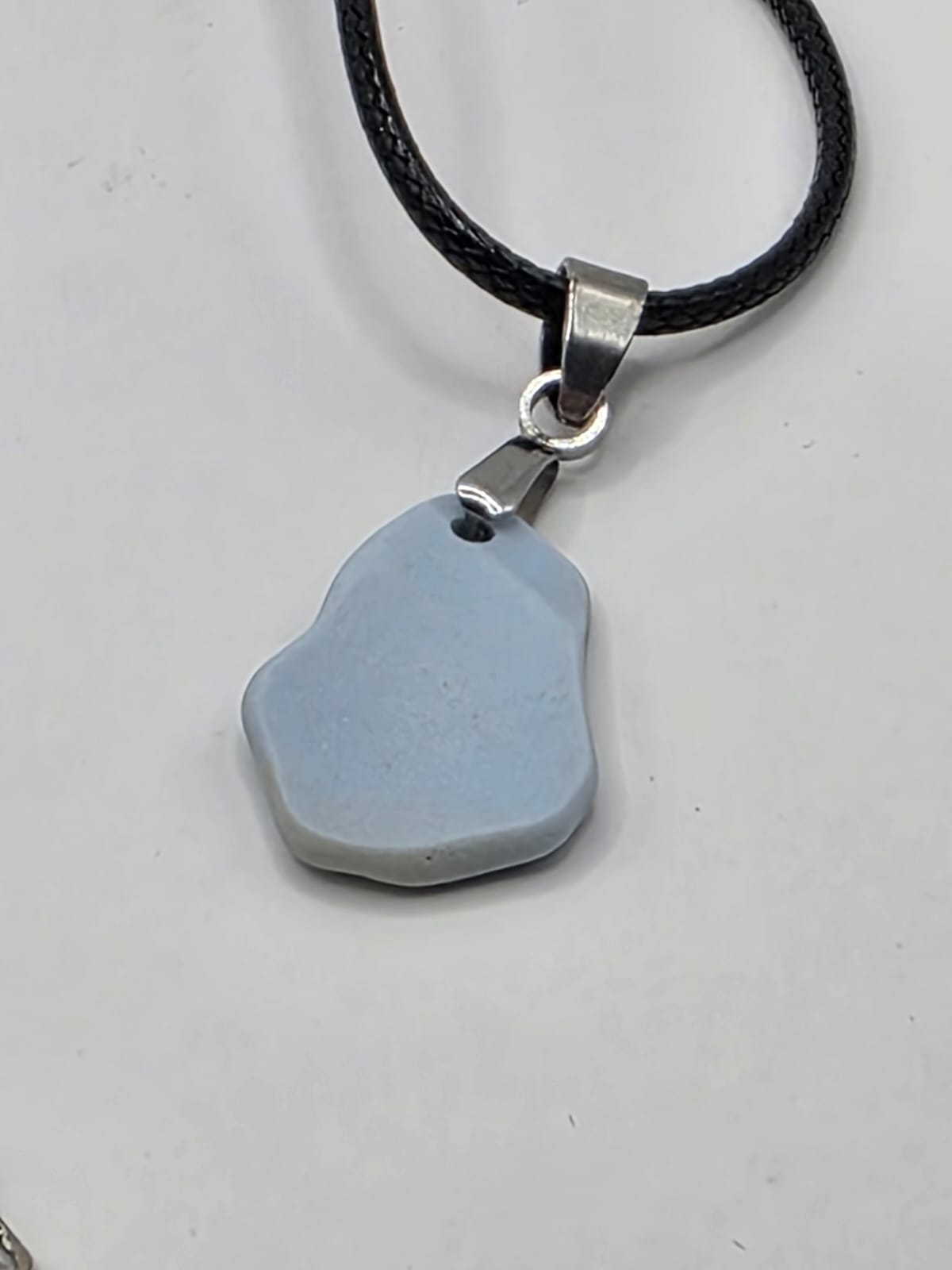 Light blue Sea pottery pendant necklace on a black waxed cord adjustable necklace