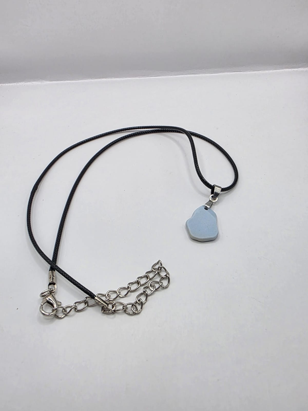 Light blue Sea pottery pendant necklace on a black waxed cord adjustable necklace
