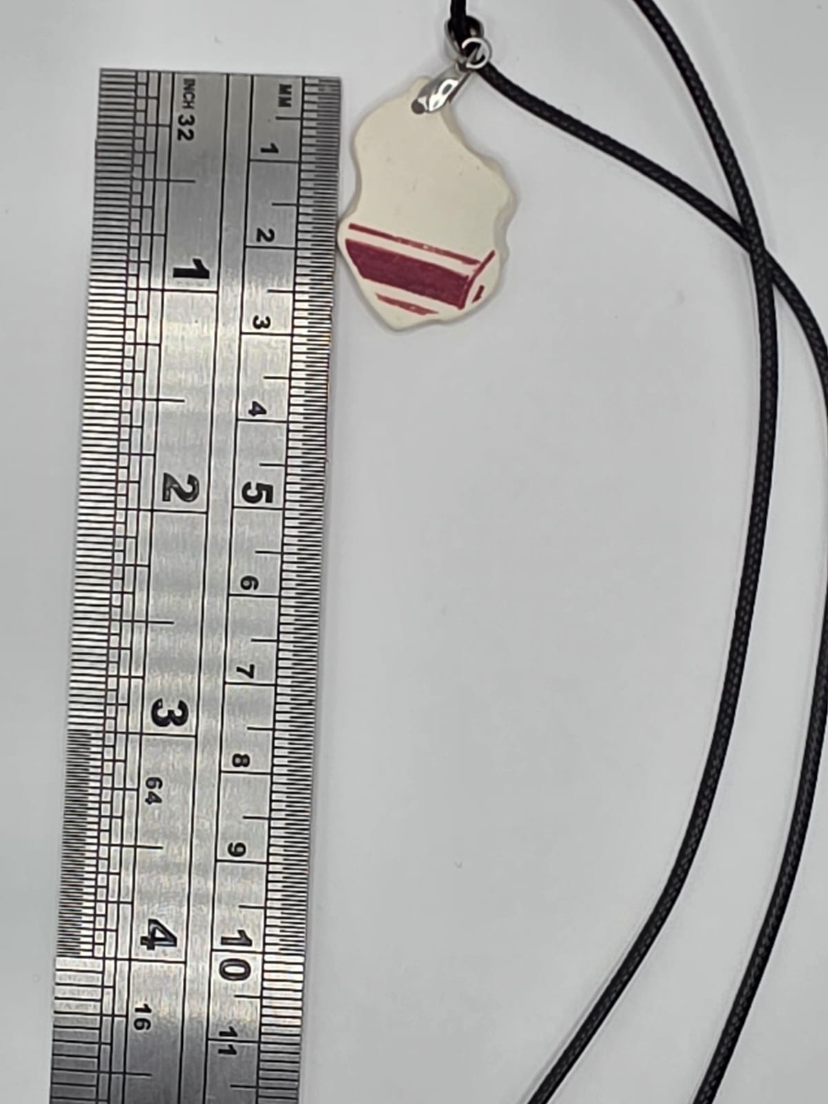 Sea pottery pendant necklace on a black waxed cord adjustable necklace
