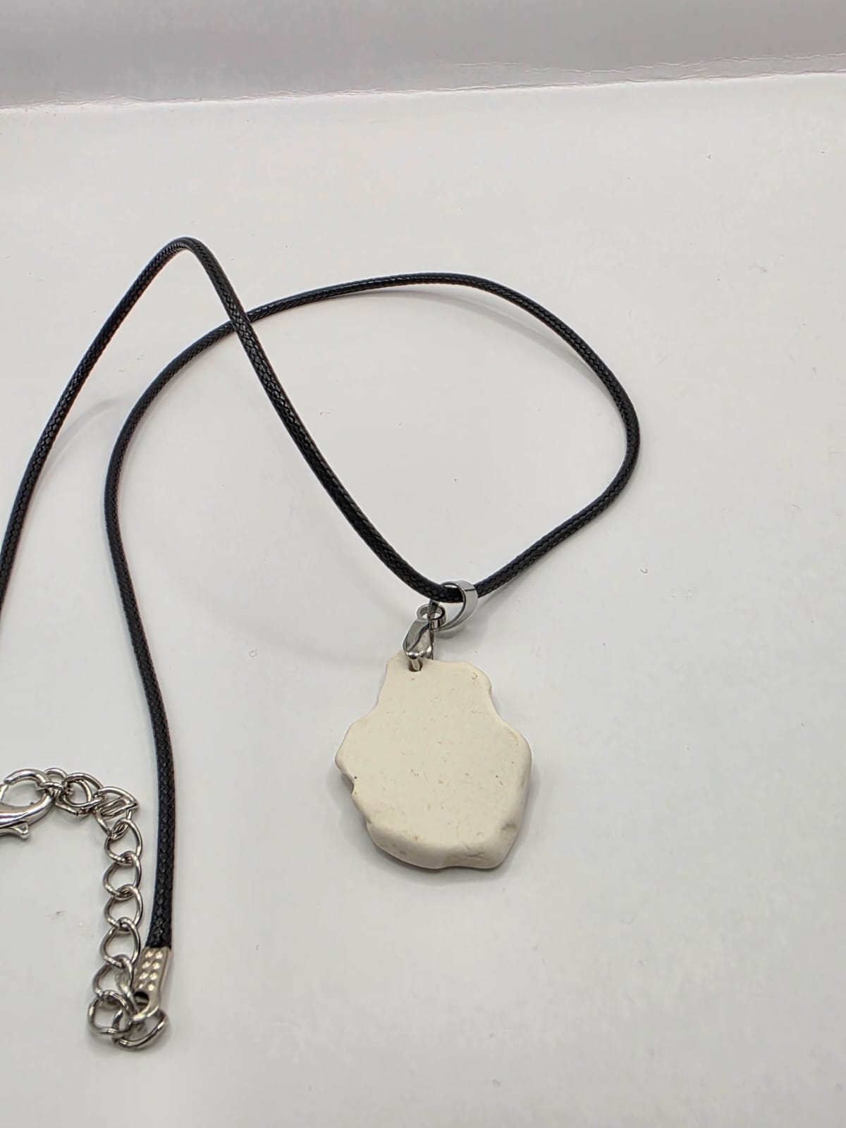 Sea pottery pendant necklace on a black waxed cord adjustable necklace