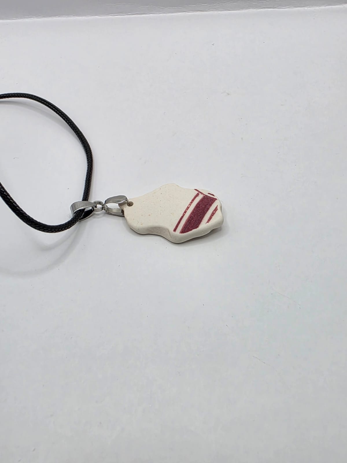 Sea pottery pendant necklace on a black waxed cord adjustable necklace