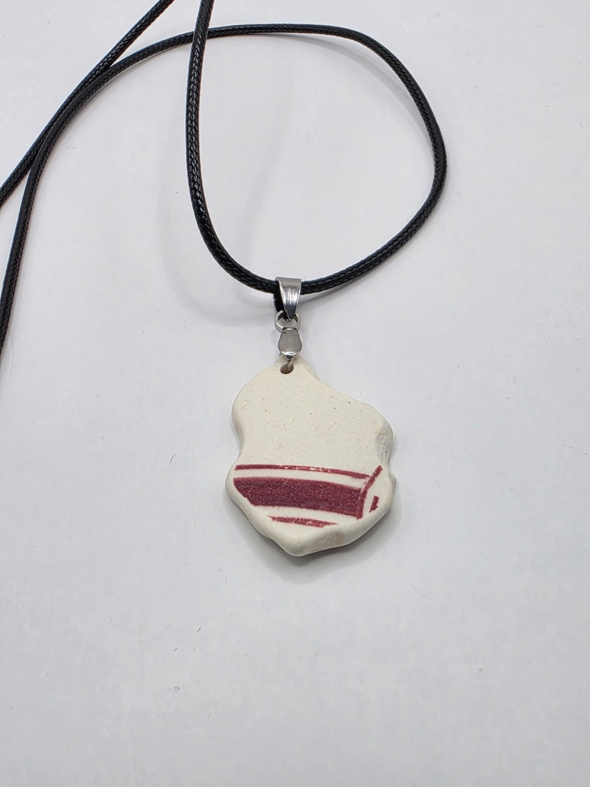 Sea pottery pendant necklace on a black waxed cord adjustable necklace