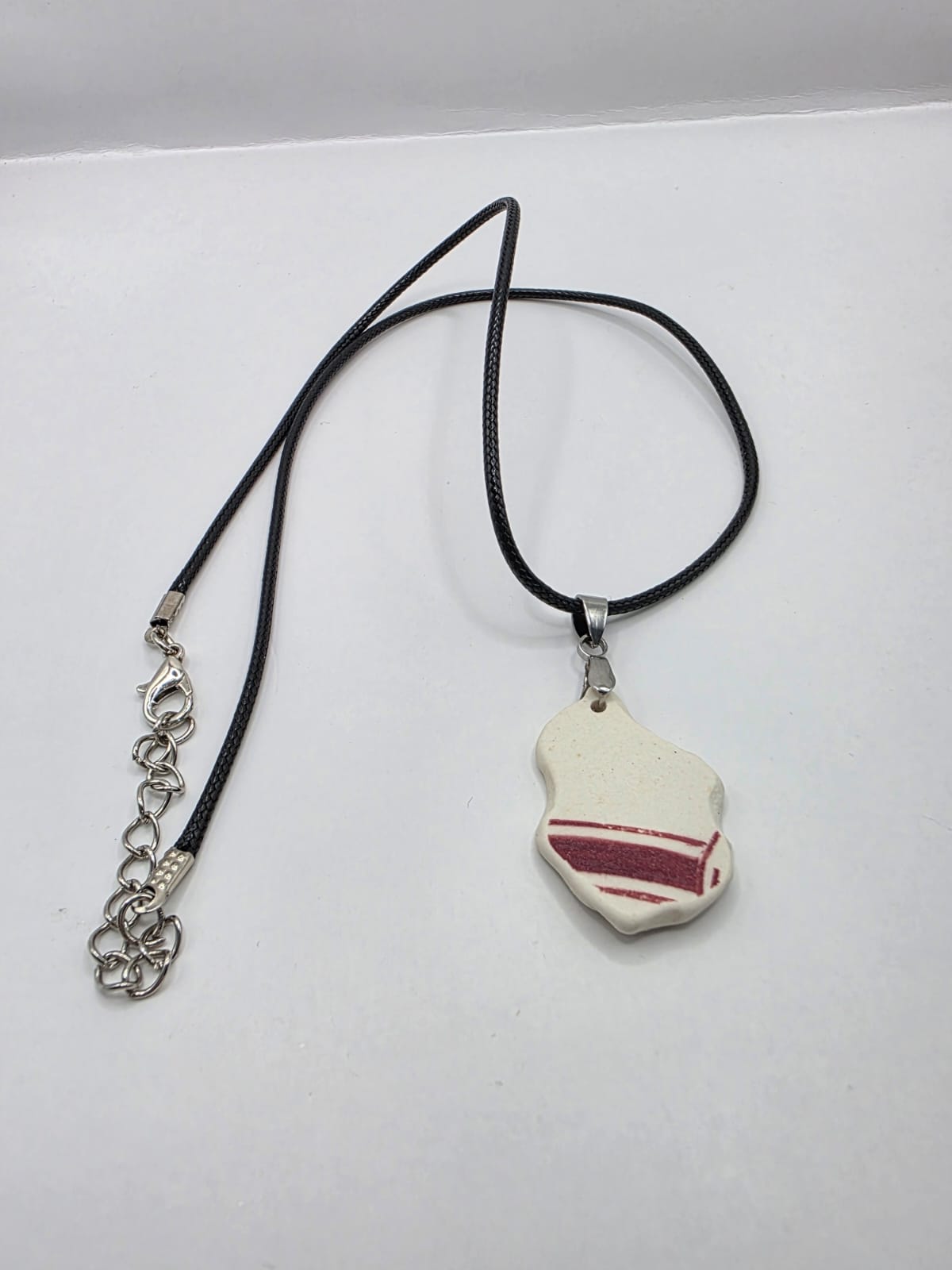 Sea pottery pendant necklace on a black waxed cord adjustable necklace
