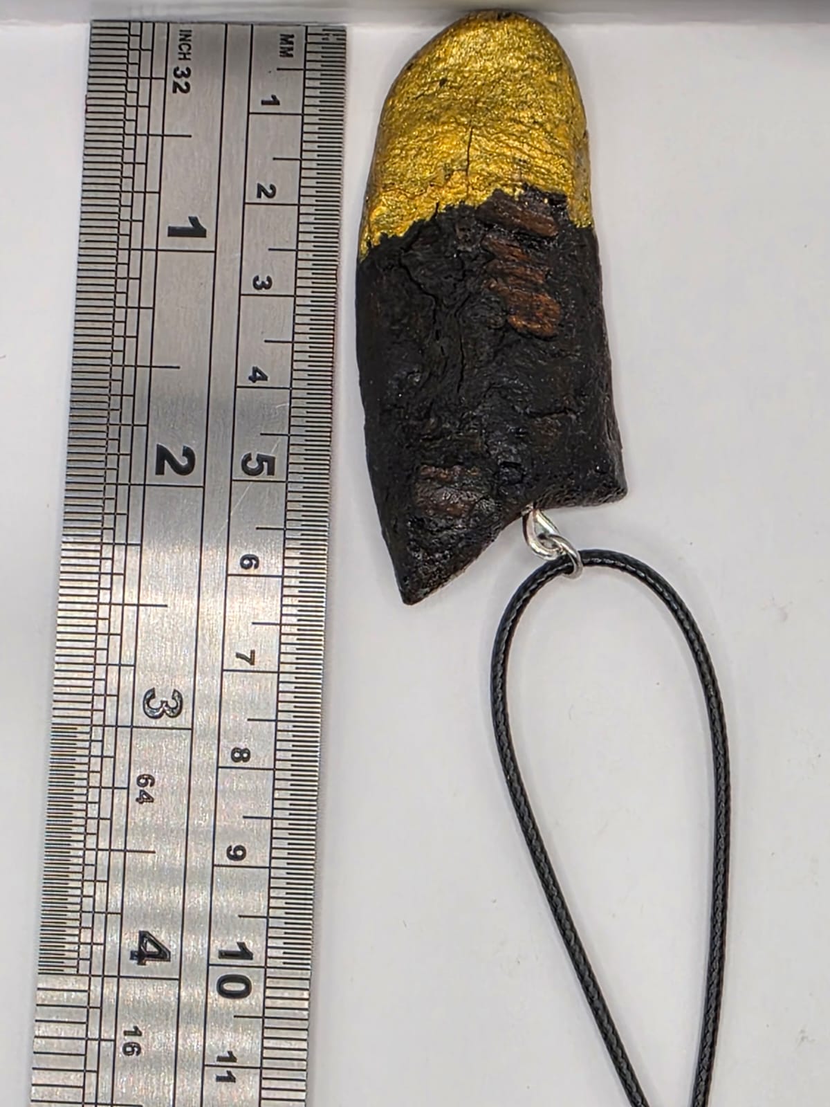 Driftwood pendant necklace featuring metallic painted style design