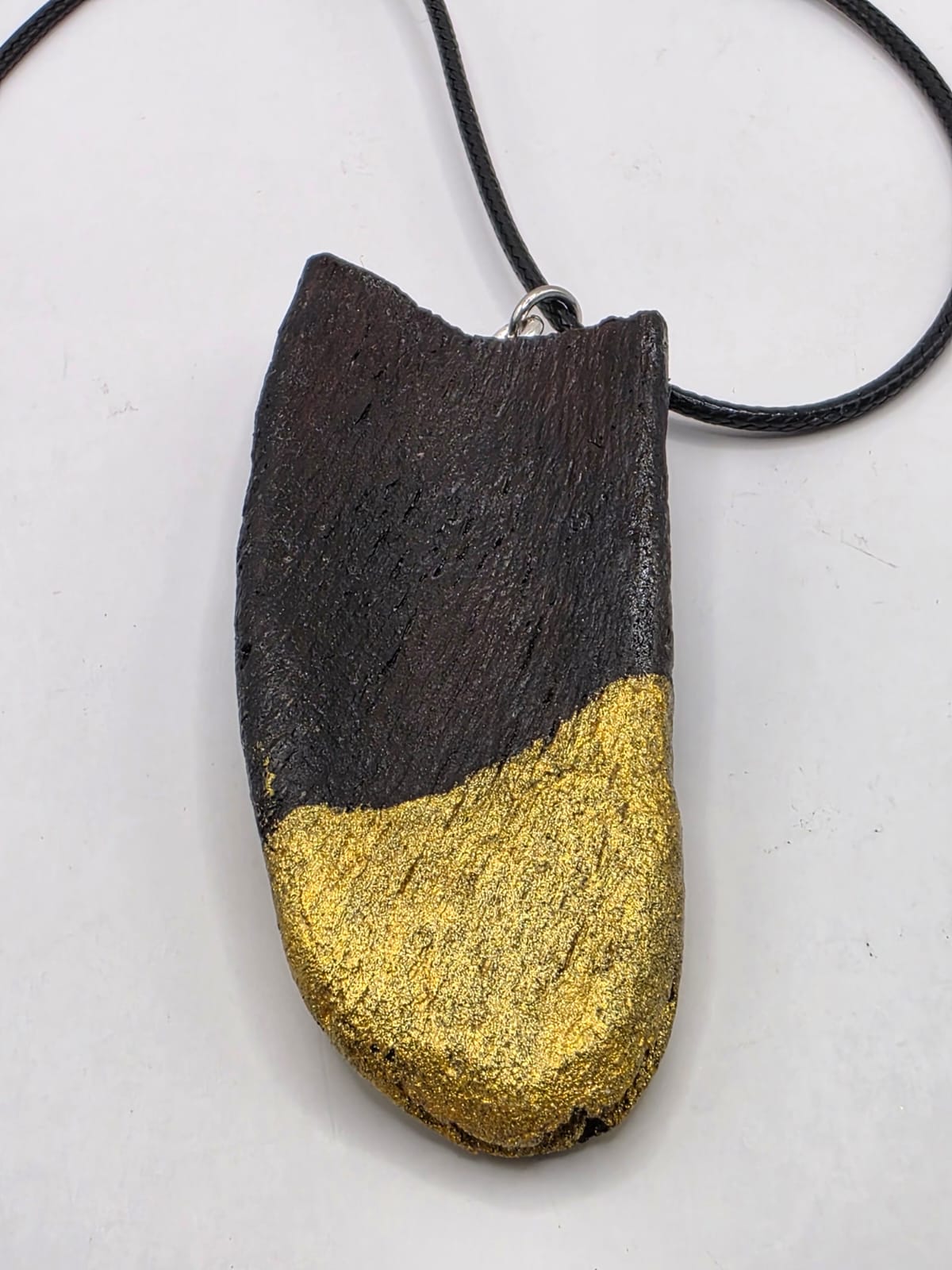 Driftwood pendant necklace featuring metallic painted style design
