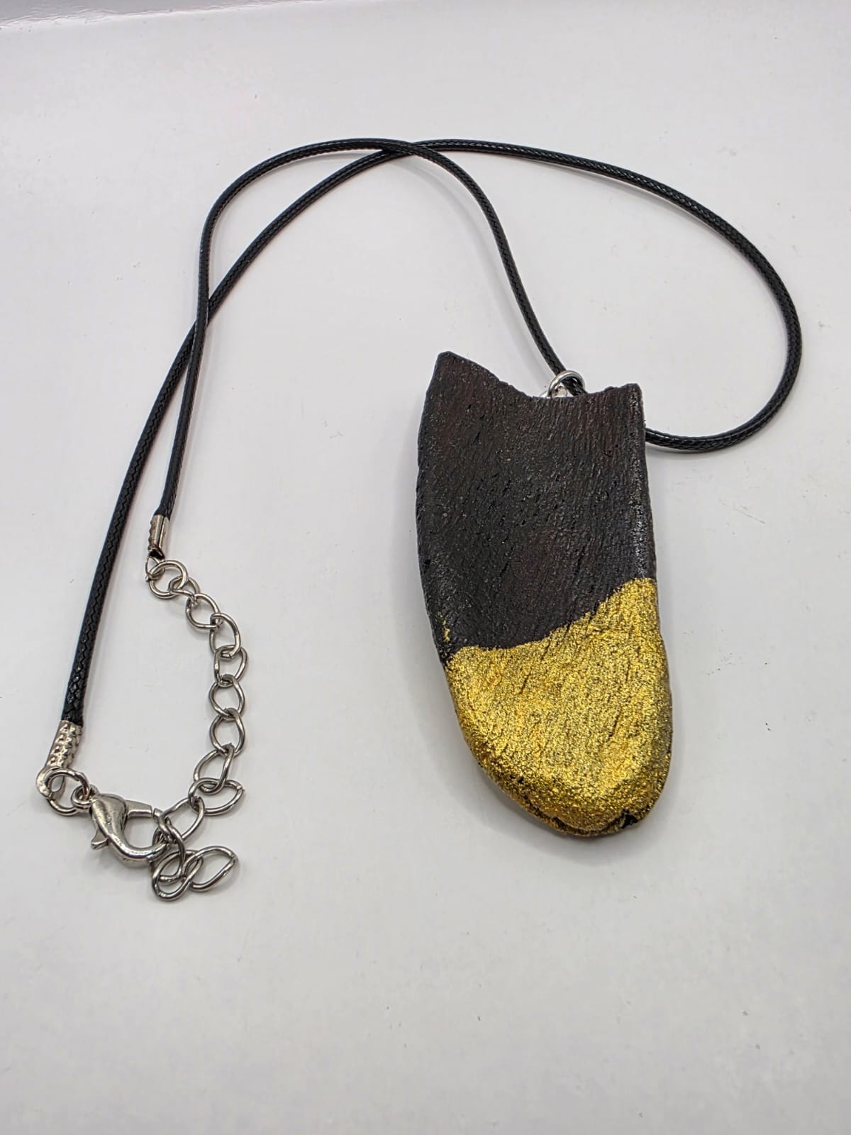 Driftwood pendant necklace featuring metallic painted style design