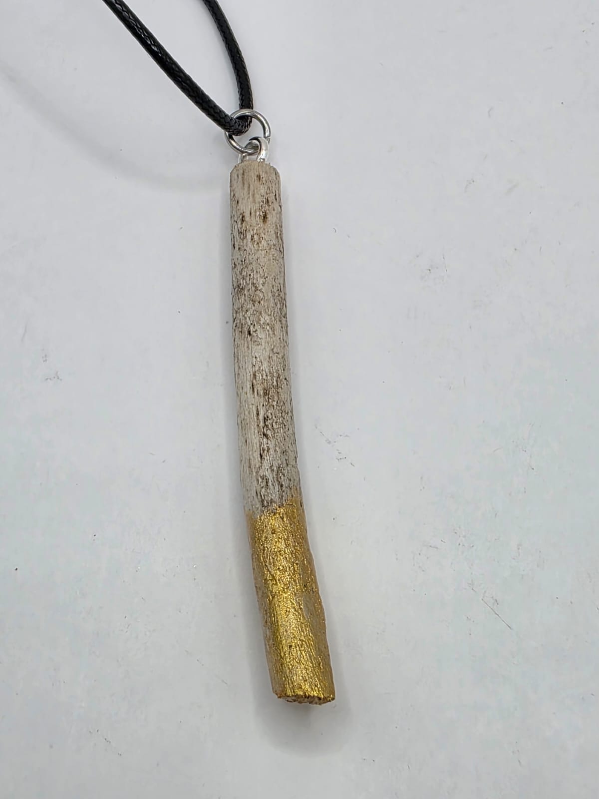 Driftwood pendant necklace featuring metallic painted style design