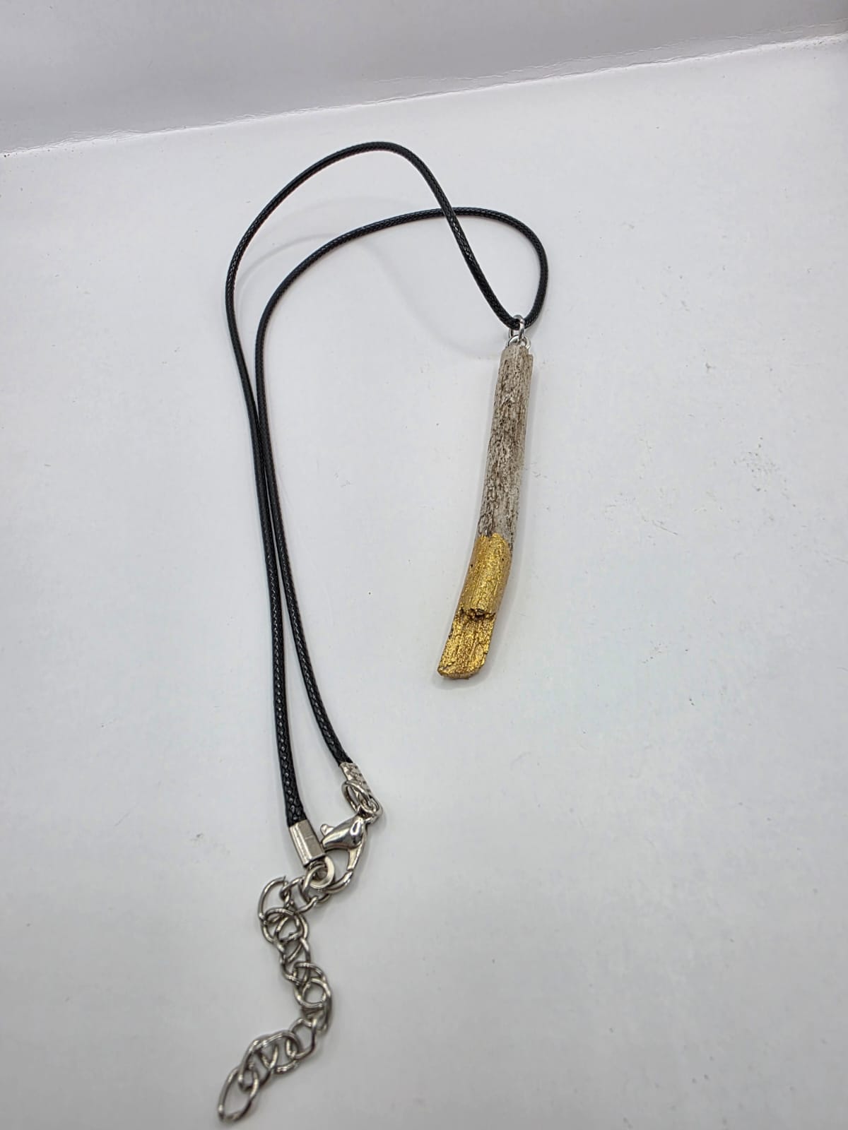 Driftwood pendant necklace featuring metallic painted style design
