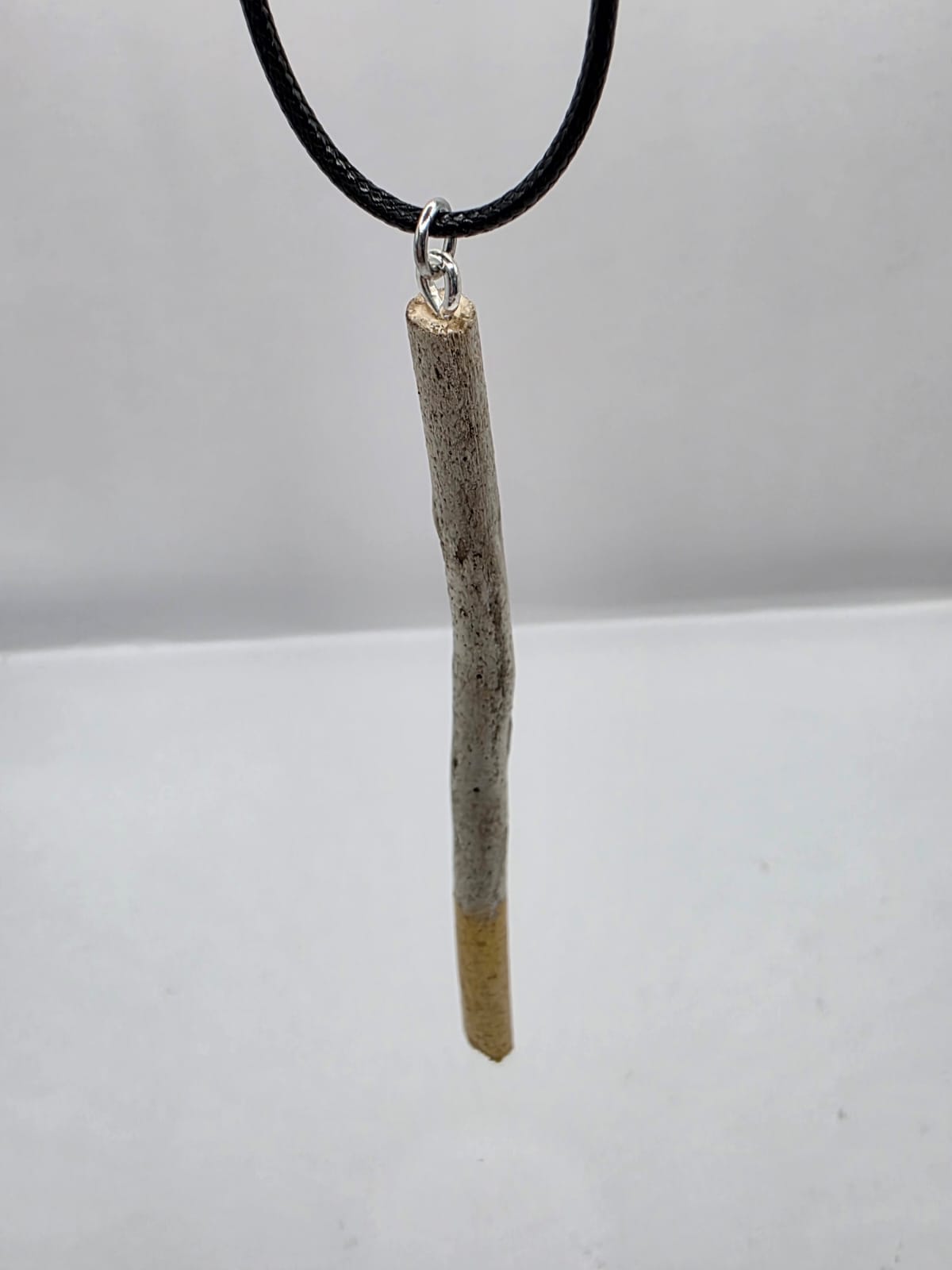 Driftwood pendant necklace featuring metallic painted style design