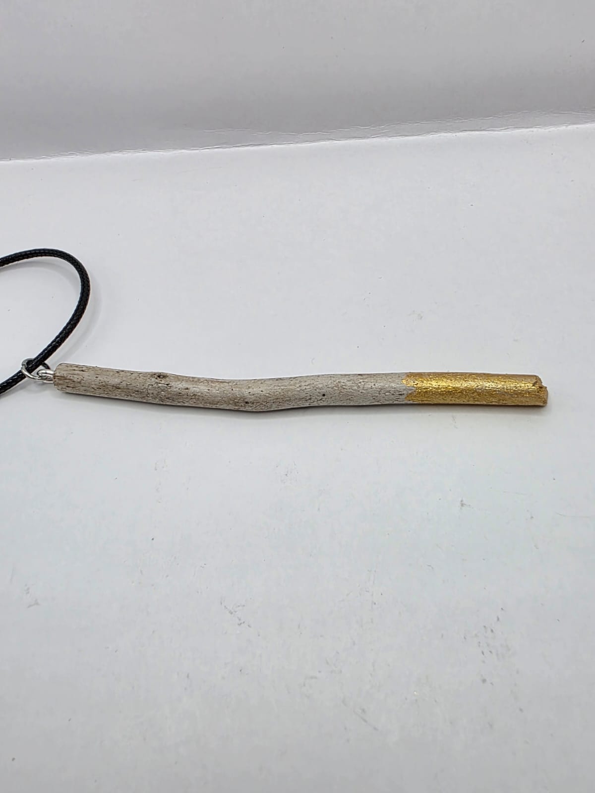 Driftwood pendant necklace featuring metallic painted style design