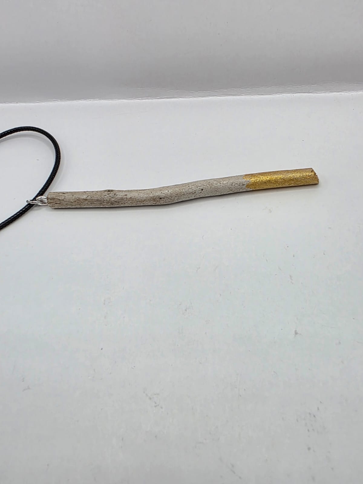 Driftwood pendant necklace featuring metallic painted style design