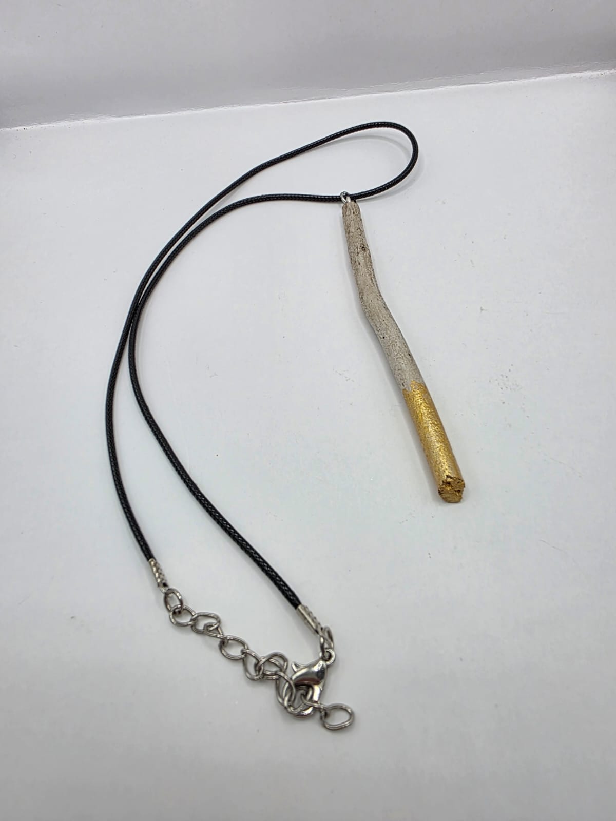 Driftwood pendant necklace featuring metallic painted style design