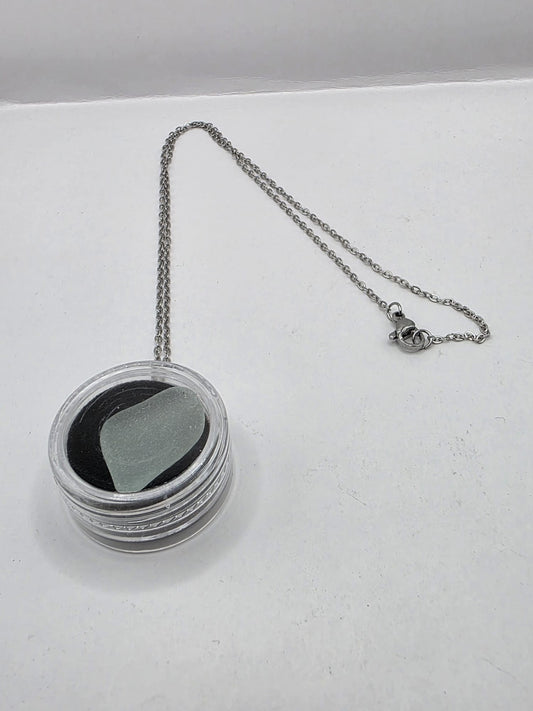 Sea Glass in a display case which can be opened as a pendant necklace on a stainless steel chain
