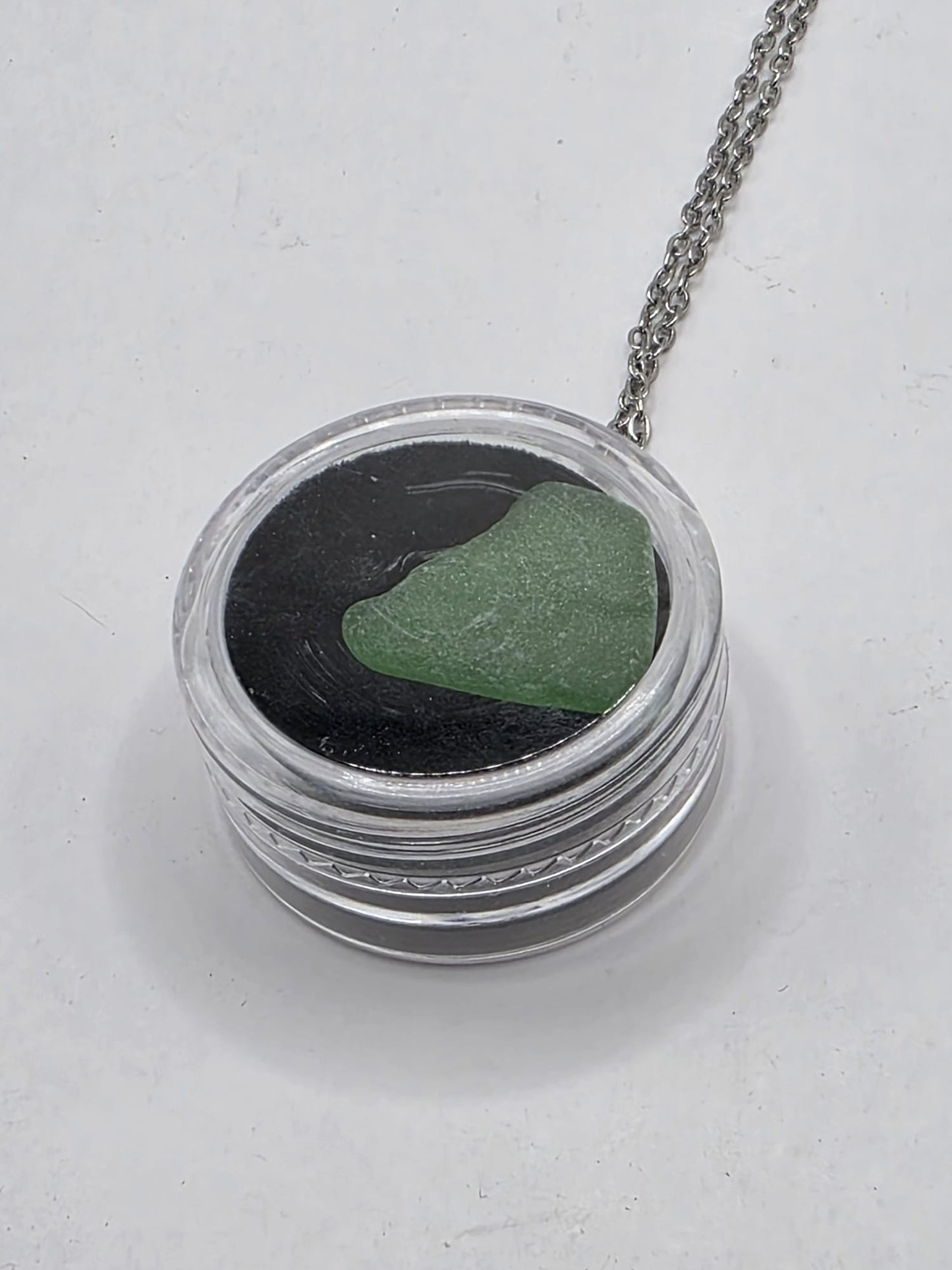 Sea Glass in a display case which can be opened as a pendant necklace on a stainless steel chain (Copy)