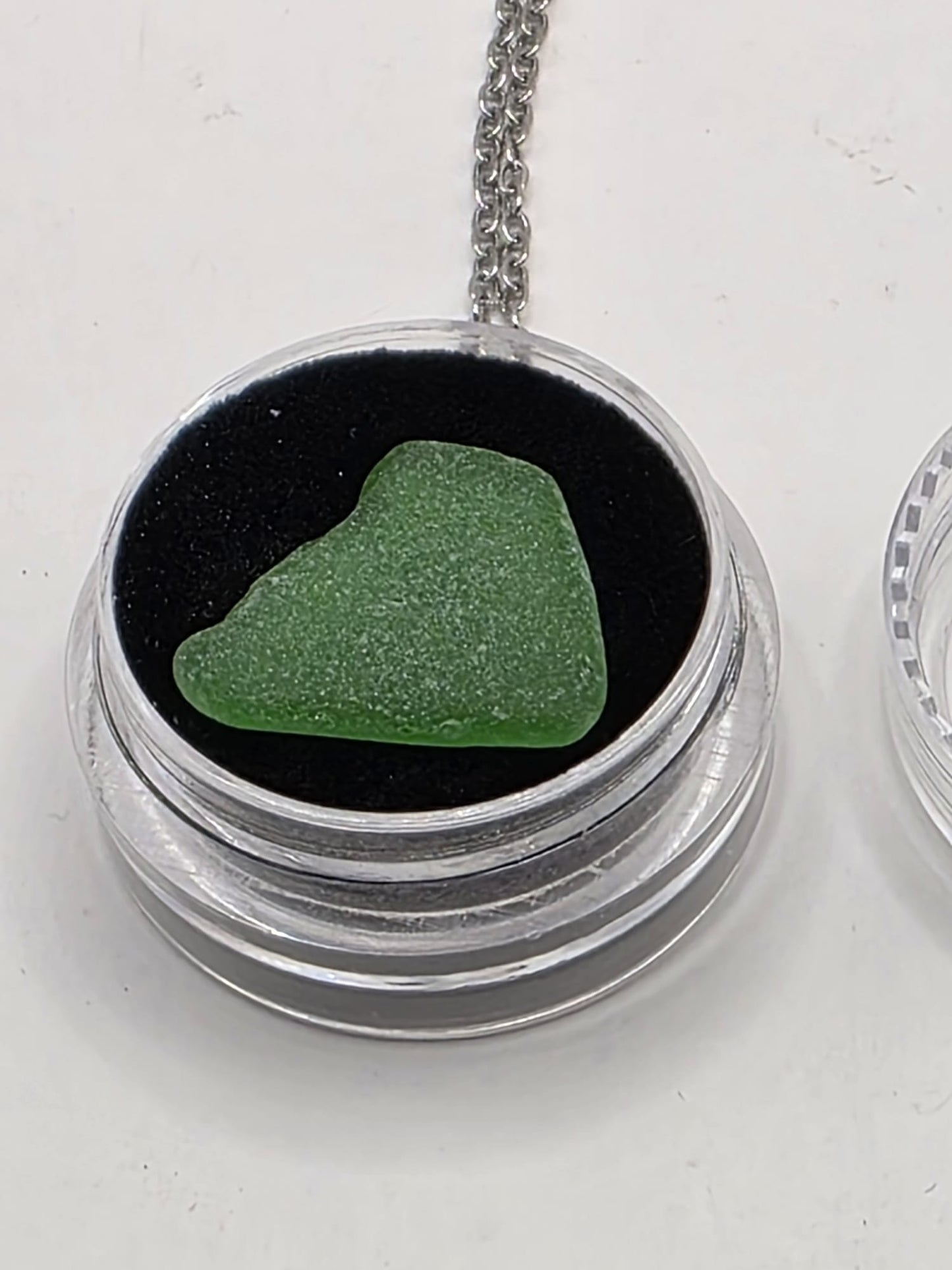 Sea Glass in a display case which can be opened as a pendant necklace on a stainless steel chain (Copy)