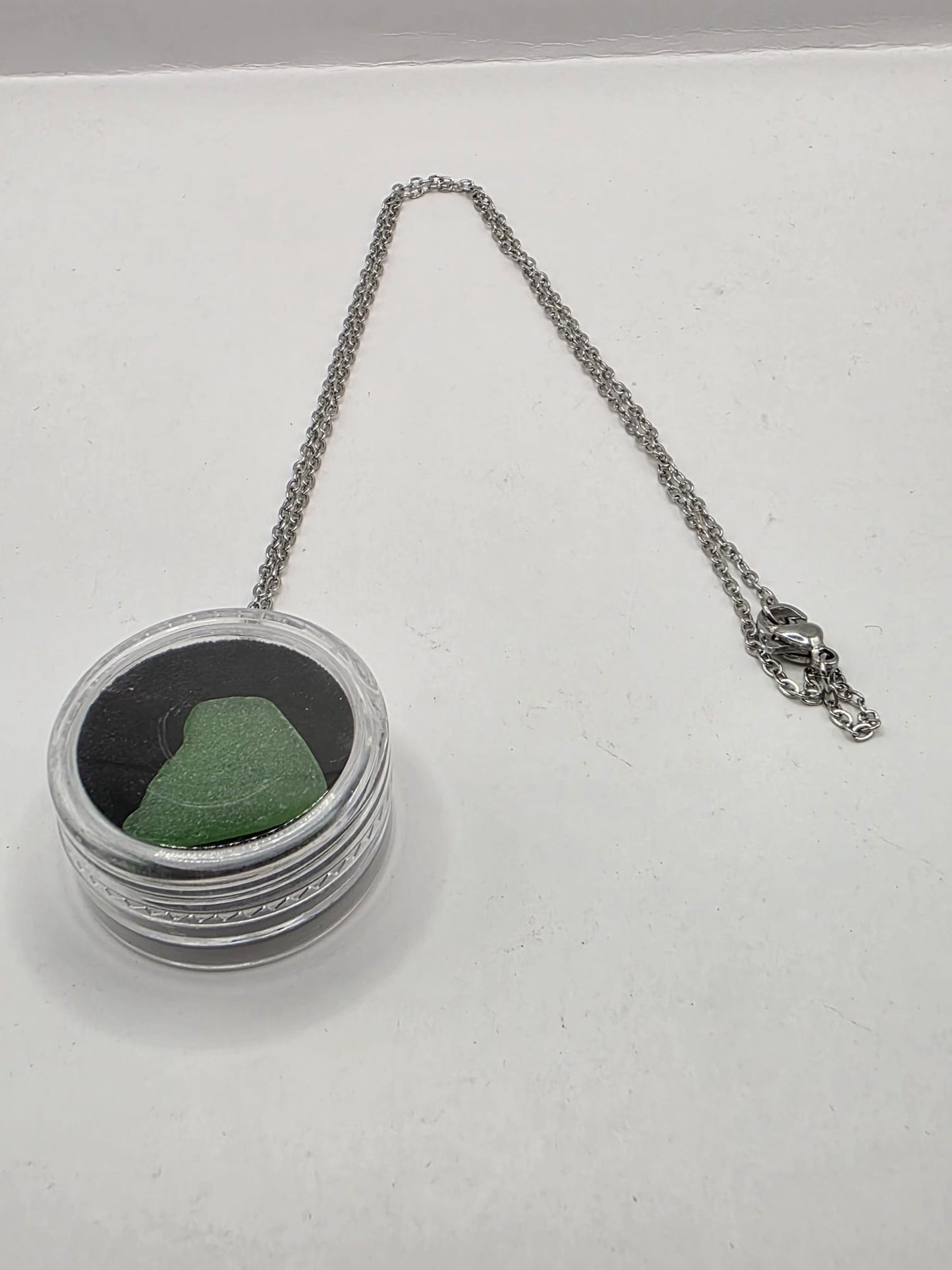 Sea Glass in a display case which can be opened as a pendant necklace on a stainless steel chain (Copy)