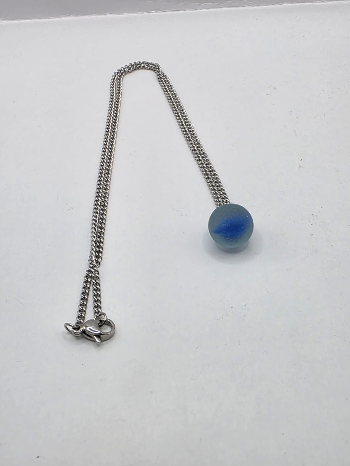 Genuine Sea Glass Blue Marble Necklace, Frosted Pendant on a stainless steel chain. Each piece is a one-of-a-kind