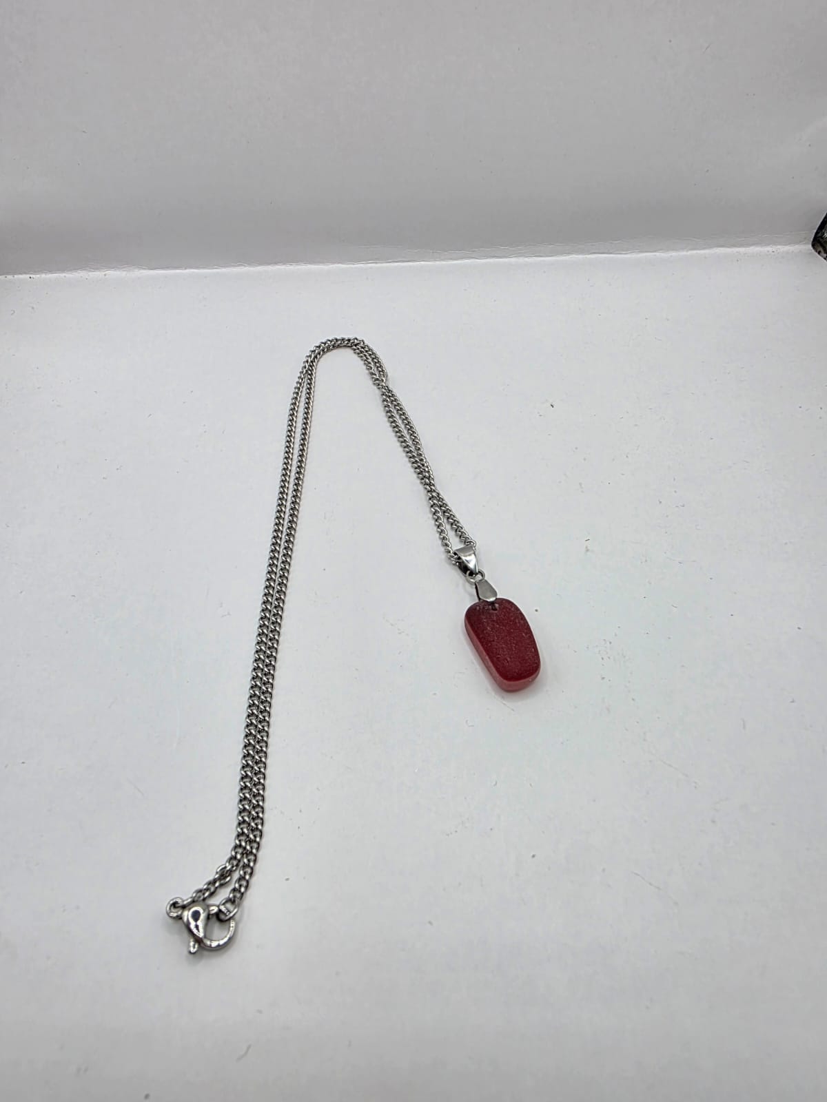 Genuine Multi Red Sea Glass Pendant Necklace on a stainless steel chain. Each piece is a one-of-a-kind