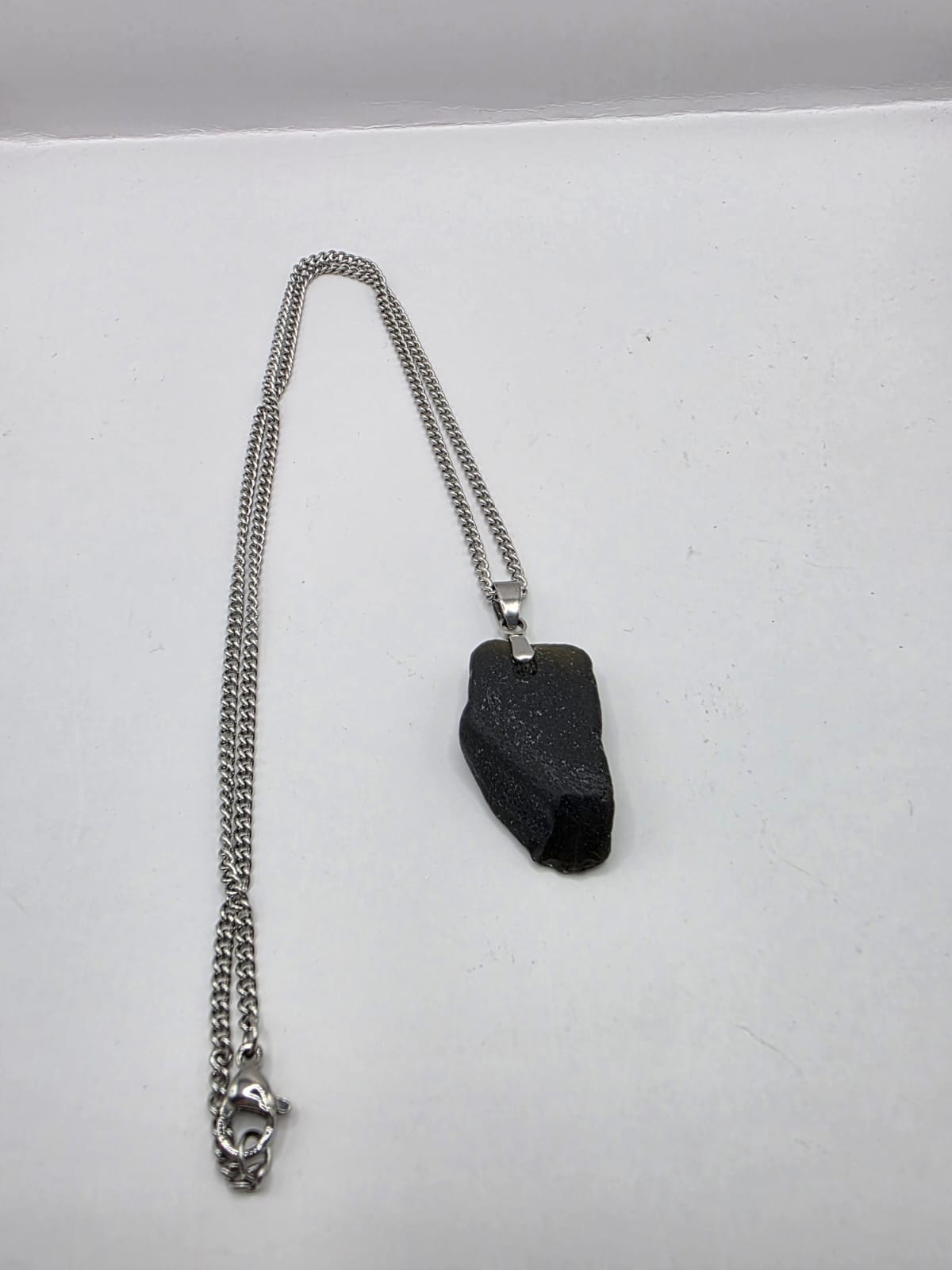 Genuine Black Sea Glass Pendant Necklace on stainless steel chain. Each piece is a one-of-a-kind
