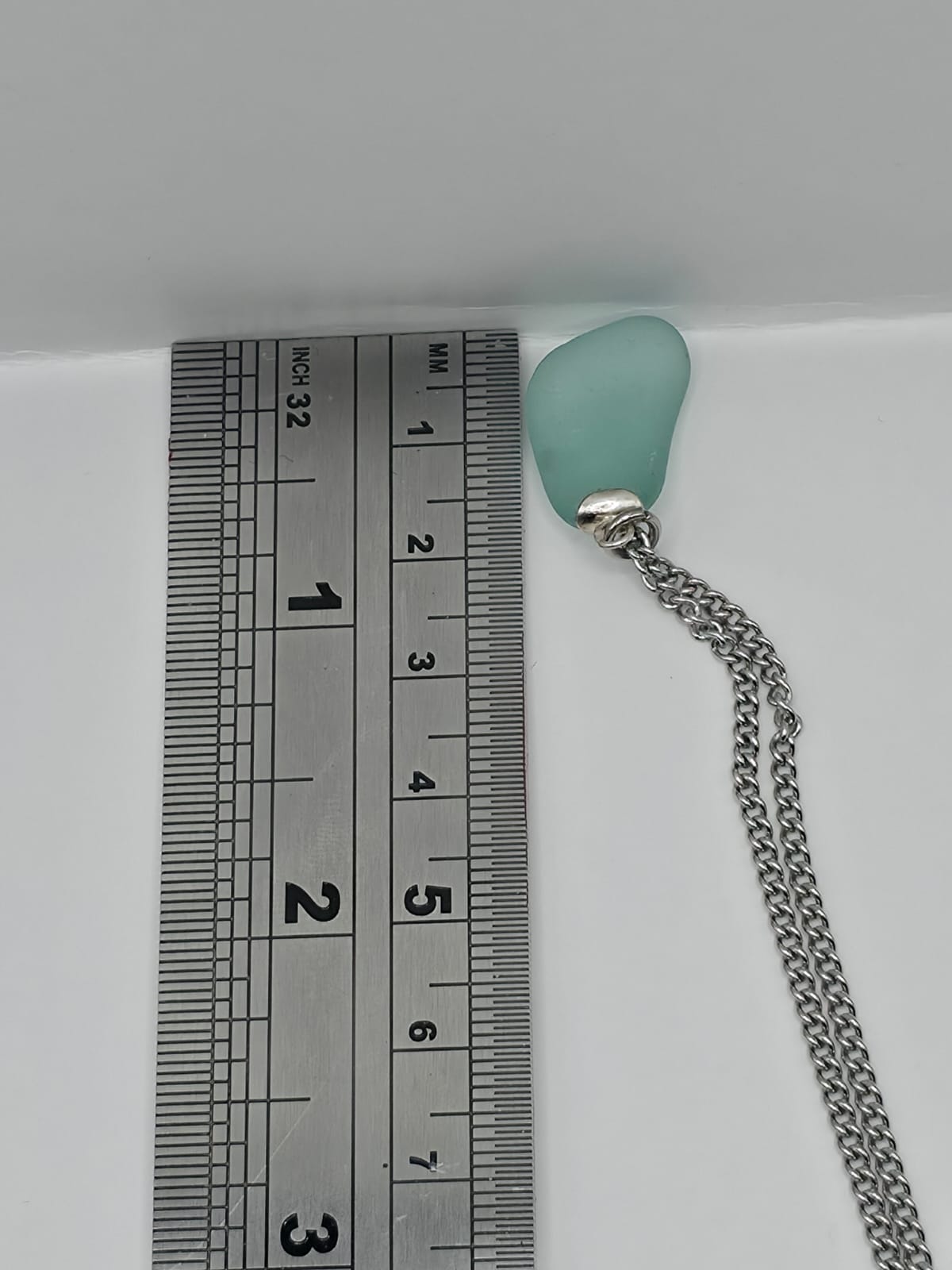 Genuine Aqua Blue Sea Glass Pendant Necklace on stainless steel chain. Each piece is a one-of-a-kind