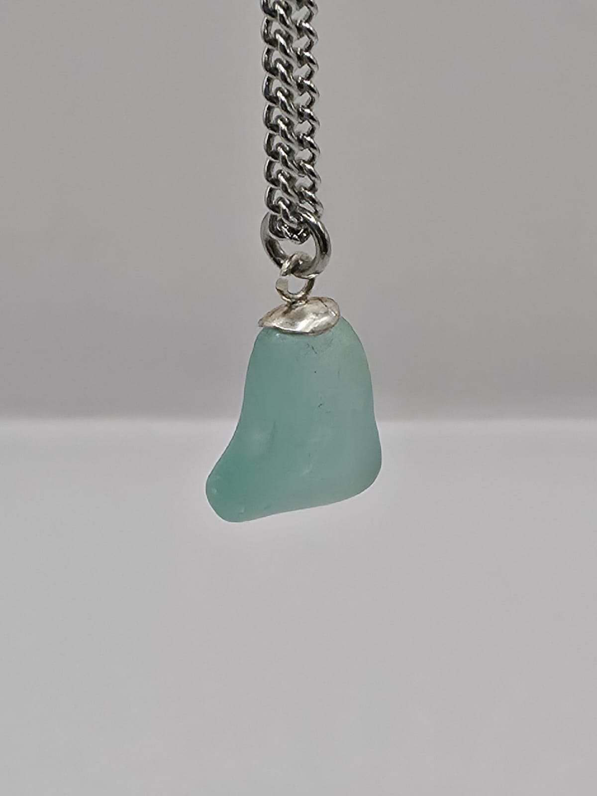Genuine Aqua Blue Sea Glass Pendant Necklace on stainless steel chain. Each piece is a one-of-a-kind