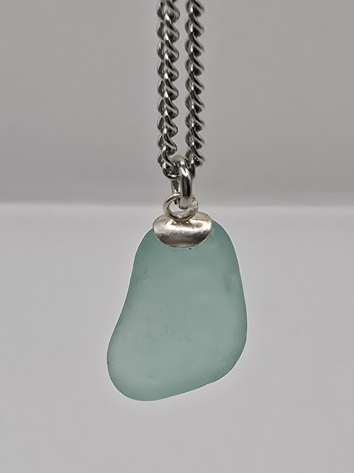 Genuine Aqua Blue Sea Glass Pendant Necklace on stainless steel chain. Each piece is a one-of-a-kind