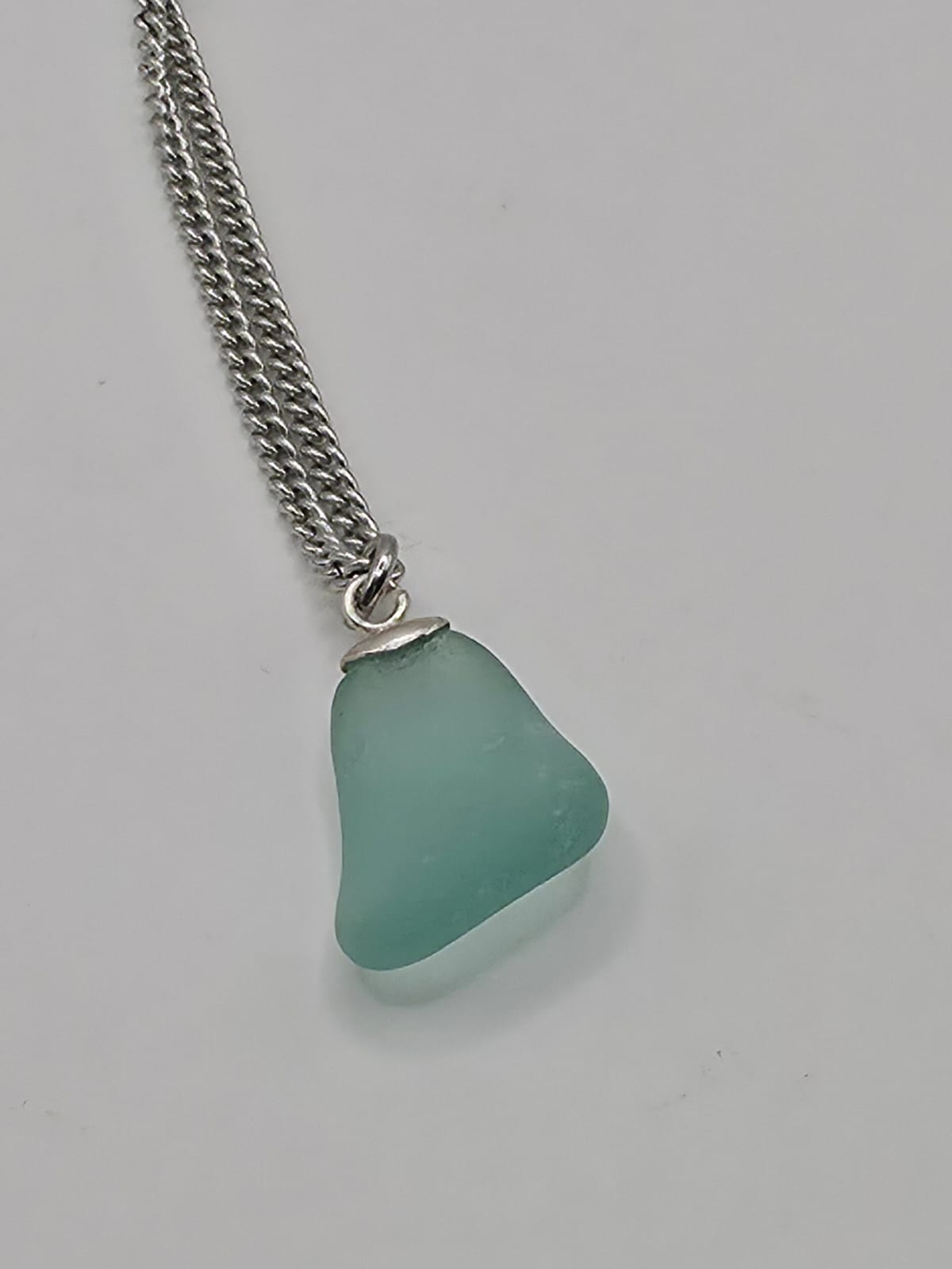 Genuine Aqua Blue Sea Glass Pendant Necklace on stainless steel chain. Each piece is a one-of-a-kind