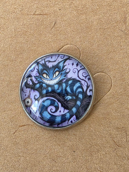 Alice in Wonderland Inspired Hellverse Cheshire Cat 20mm Stainless Steel Glass Cabochon Pin
