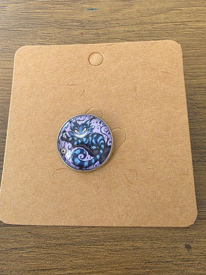 Alice in Wonderland Inspired Hellverse Cheshire Cat 20mm Stainless Steel Glass Cabochon Pin
