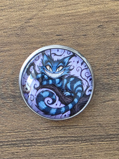 Alice in Wonderland Inspired Hellverse Cheshire Cat 20mm Stainless Steel Glass Cabochon Pin