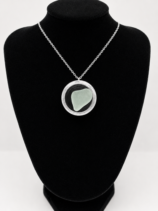 Sea Glass in a display case which can be opened as a pendant necklace on a stainless steel chain
