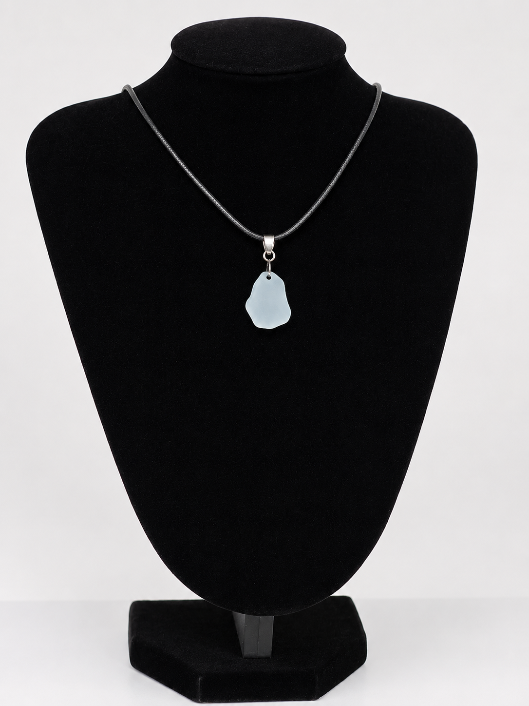 Light blue Sea pottery pendant necklace on a black waxed cord adjustable necklace